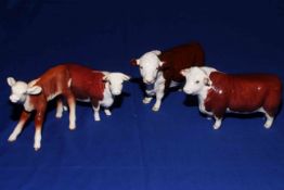 Two Beswick Hereford bulls, 'Ch. of Champions' 1363A and 2549, cow 1360 and calf 901B (4).