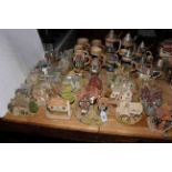 Thirty Lilliput Lane figures and eighteen beer steins.