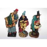 Three Royal Doulton Figures, The Pied Piper HN2102, The Mask Seller HN2103 and Carpet Seller HN1464.