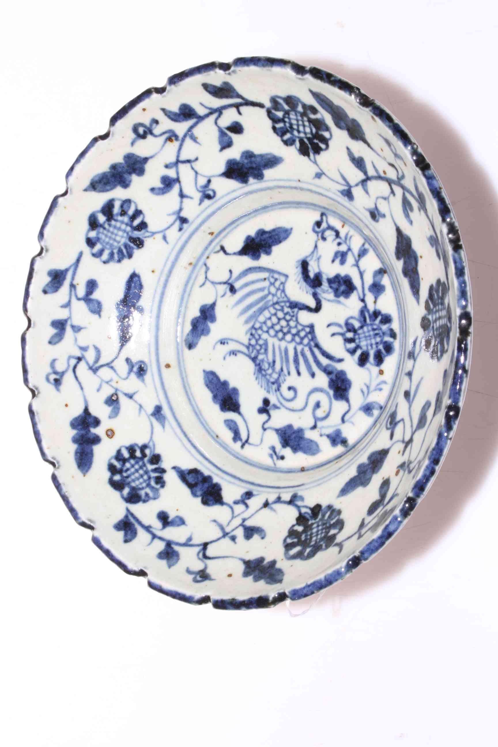Chinese stoneware blue and white dish with exotic bird and foliate decoration,