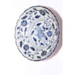 Chinese stoneware blue and white dish with exotic bird and foliate decoration,