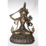 Gilt bronze goddess with 'jewelled' decoration, 31cm.