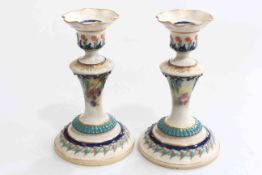 Pair of Hadley's Royal Worcester candlesticks, painted with berries, shape No. 265B, 15.5cm.