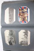 Album of WWI postcards including silks, soldiers, patriotic and war damage.