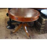 Mahogany leather inset topped revolving drum table having three drawers and five faux drawers on