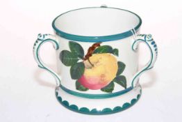 Wemyss ware tyg decorated with apples, 10.5cm.