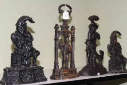 Four cast iron door stops.