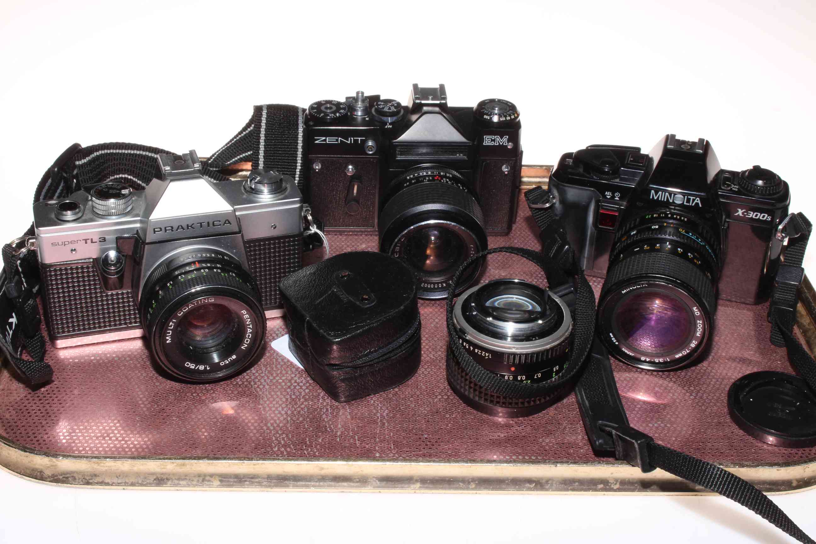 Praktica, Zenit and Minolta cameras and two lenses.