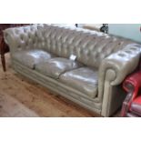 Taupe deep buttoned leather three seater Chesterfield settee, length 200cm.