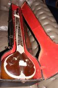 Large cased 20th Century Indian sitar, marked BINA.