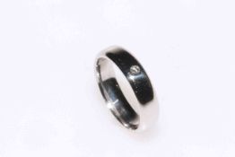 Palladium band ring set with single small diamond, size V.