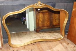 Shaped gilt framed overmantel mirror, 100cm by 149cm overall.