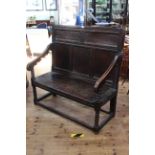 Antique oak panelled back settle with bobbin pillars, 119cm by 115cm.