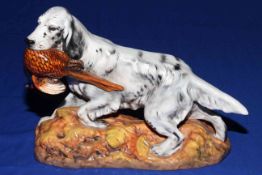 Royal Doulton model of an English setter carrying a pheasant, HN 2529, designed by Frederick Daws.