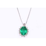 Emerald and diamond pendant set in 18 carat white gold with necklace, emerald weight 3.3 carat.