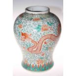 Chinese famille verte ovoid vase decorated with exotic birds, 36cm high.
