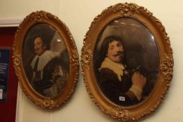 Pair gilt framed oval portrait prints of cavaliers.