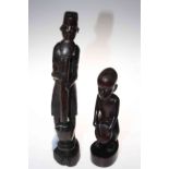 Two African carved wood figures.