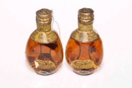 Two miniature dimple Haig whisky's.