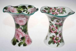 Two Wemyss ware Lady Eva vases decorated with wild roses and cabbage roses, 20cm high.