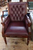 Regency style deep buttoned and studded armchair.