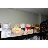 Eight Giorgio Beverley Hills teddy bears including Millennium Bear.