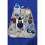 Caithness and other paperweights and seven scent bottles.