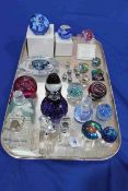 Caithness and other paperweights and seven scent bottles.