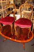 Pair Victorian walnut cabriole leg parlour chairs, oval coffee table and nest of three tables.