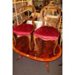 Pair Victorian walnut cabriole leg parlour chairs, oval coffee table and nest of three tables.