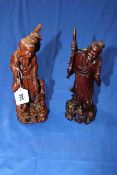 Two Oriental carved wood figures.