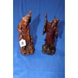 Two Oriental carved wood figures.