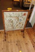 Walnut framed glazed needlework panel firescreen, 87cm by 62.5cm.