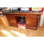 Victorian mahogany nine drawer pedestal desk with pitch pine top, 80cm by 152cm.