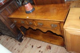 Period style three drawer oak potboard dresser, 76.5cm by 118cm.