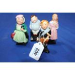 Four Royal Doulton Dickens character miniatures.