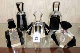 Five Art Deco style scent bottles.