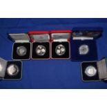 Collection of Royal Mint £5 silver proof coins with COAs and boxed,
