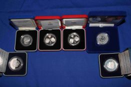 Collection of Royal Mint £5 silver proof coins with COAs and boxed,