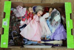 Box of dolls and outfits.