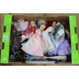 Box of dolls and outfits.