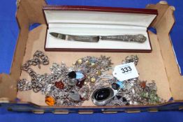 Collection of mostly silver jewellery including charm bracelet.