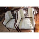 Pair Edwardian mahogany occasional chairs in striped fabric.