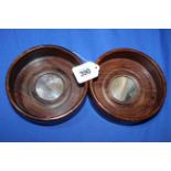 Pair of silver mounted turned hardwood wine bottle coasters.