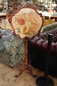 Victorian mahogany tripod screen with glazed floral needlework panel, 144cm by 59cm.