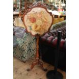 Victorian mahogany tripod screen with glazed floral needlework panel, 144cm by 59cm.