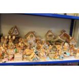 Shelf collection of Pendelfin Village and Pendelfin ornaments, approximately eight five.