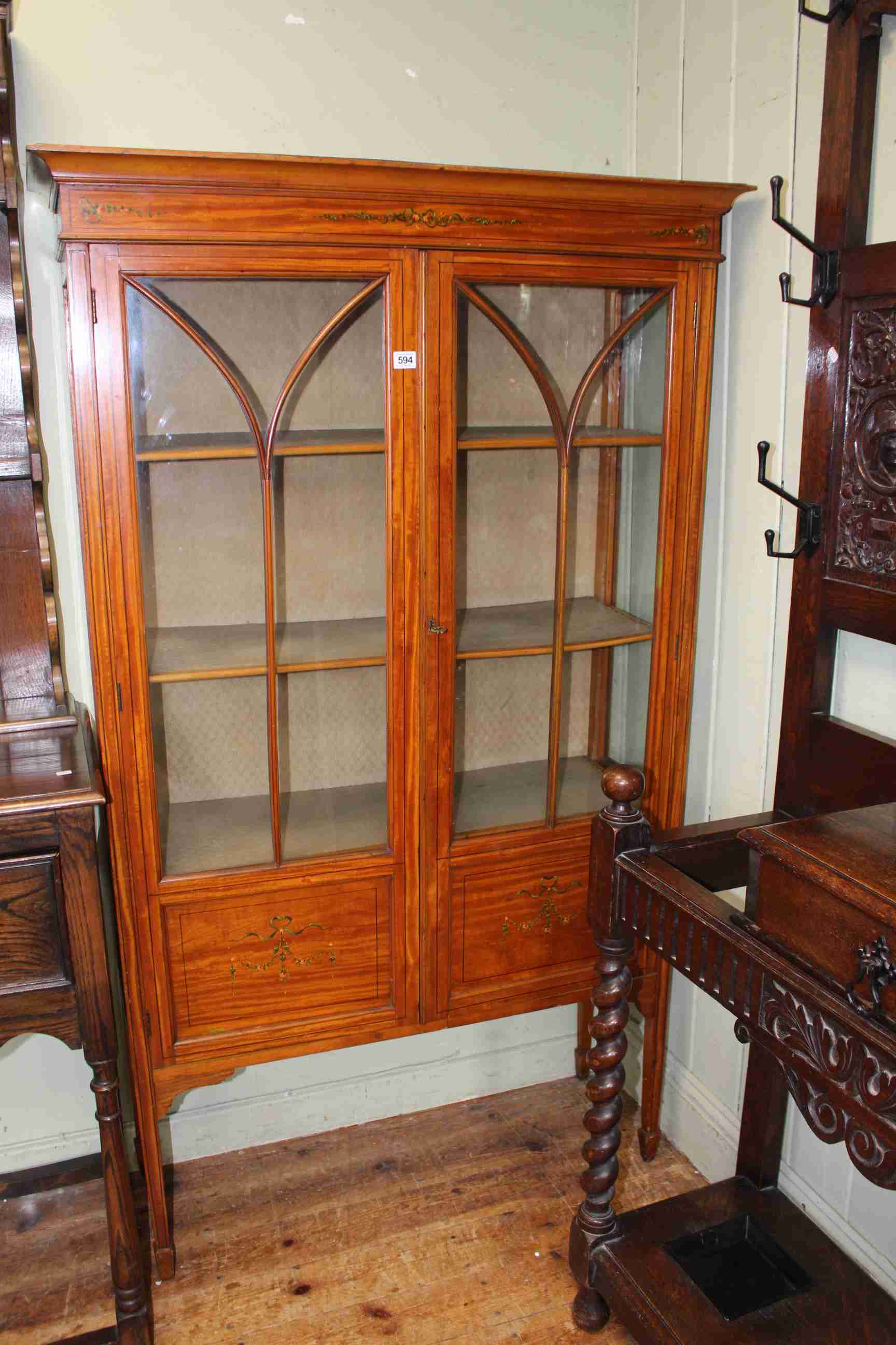 Edwardian painted satinwood two door vitrine on square tapering legs, 168cm by 99cm.