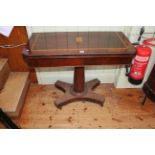 Victorian inlaid rosewood fold top card table on turned pedestal to inverted quadriform base,