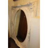 Large Dutch ivory coloured framed oval wall mirror, 157cm by 126cm overall.